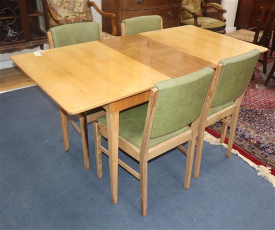 A Gordon Russell teak dining suite table 152cm extended